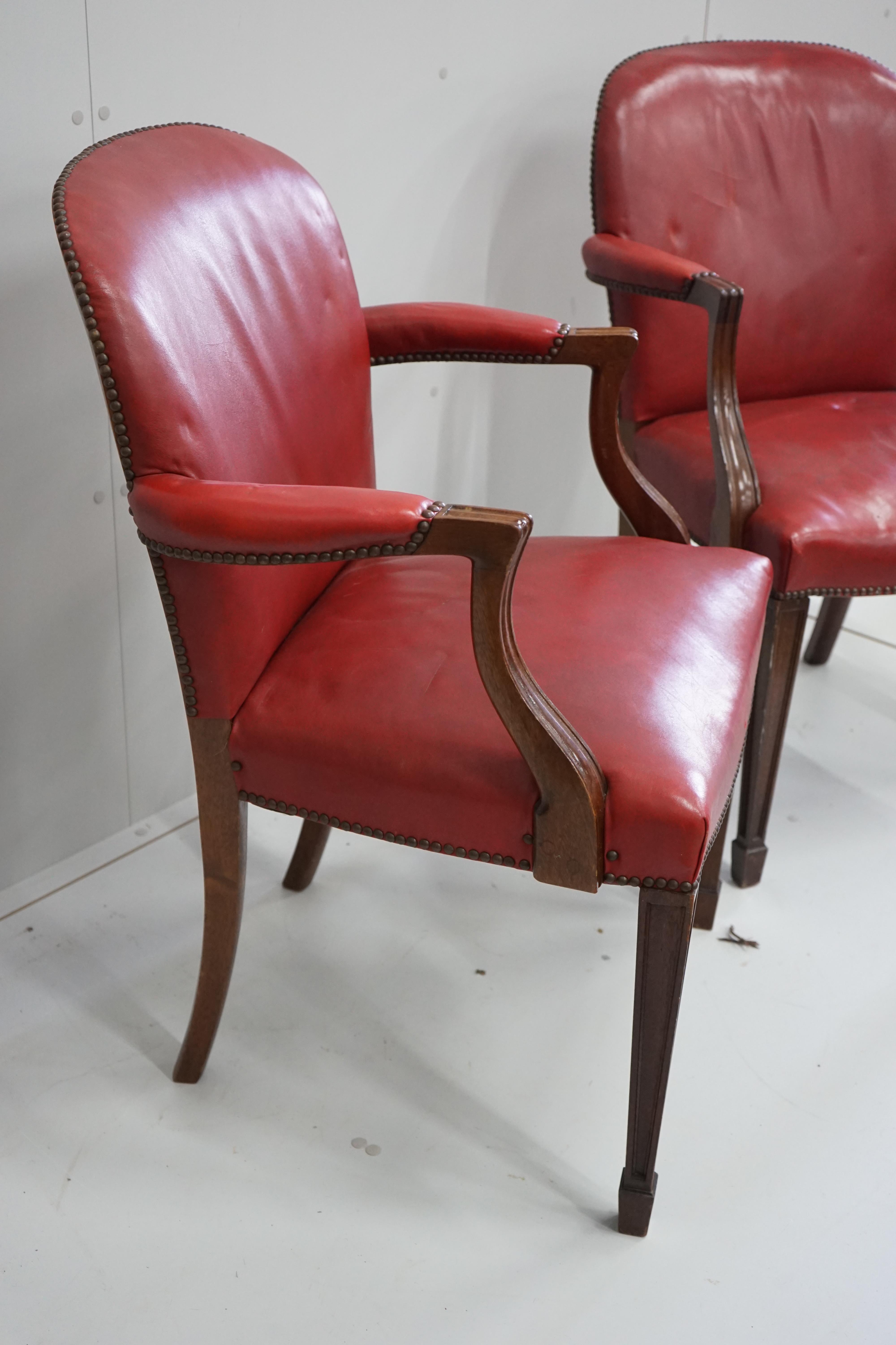 A pair of early 20th century elbow chairs, width 63cm, depth 52cm, height 94cm